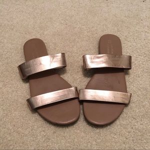 Metallic gold flip flops